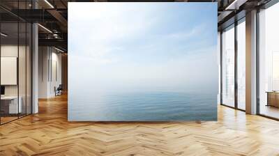 calm tranquil blue sea with no waves and with foggy backgroudn Wall mural