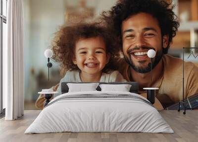 A cheerful father and daughter with curly hair grinning happily, creating a sweet moment together, embodying happiness and pure joy in the simple act of being family. Wall mural