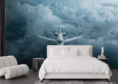 A stunning image of a private jet smoothly flying through dense, picturesque clouds, capturing the essence of luxury travel and the freedom of flight in clear blue skies. Wall mural