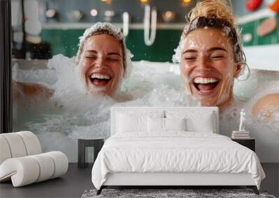 Two women enjoy laughter and relaxation together in a luxurious, foamy bubble bath, capturing leisure, friendship, and a carefree moment of refreshment and joy. Wall mural