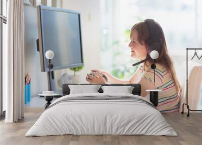 Child doing homework on computer. Online class. Wall mural