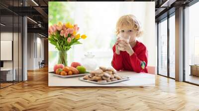 Child eating breakfast. Kid drinking milk. Wall mural