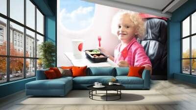 Child in airplane. Kids fly. Children flight meal Wall mural