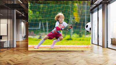 Child playing football. Kids play soccer. Wall mural