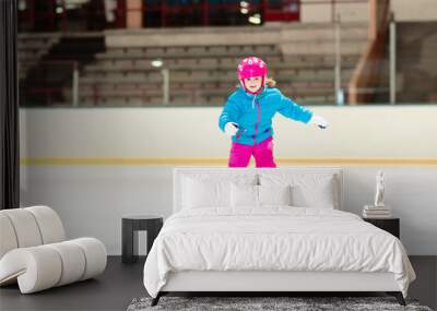 Child skating on indoor ice rink. Kids skate. Wall mural