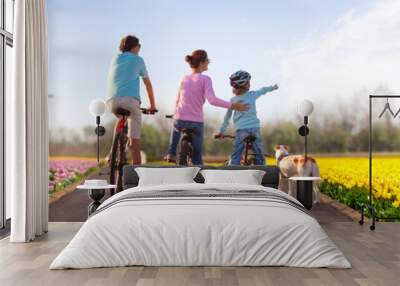 Holland tulip fields. Family on bike. Netherlands. Wall mural