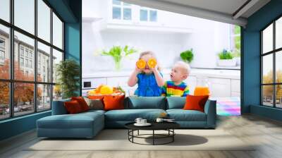 Kids drinking orange juice Wall mural