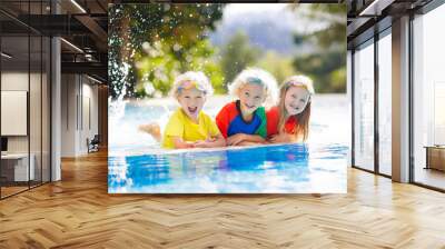 Kids in swimming pool. Children swim. Family fun. Wall mural