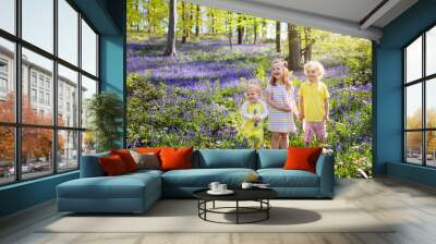 Kids playing in bluebell woods Wall mural