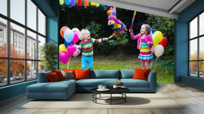 Kids playing with birthday pinata Wall mural