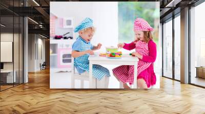 Kids playing with toy kitchen Wall mural