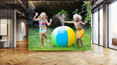 Kids playing with water ball toy sprinkler Wall mural