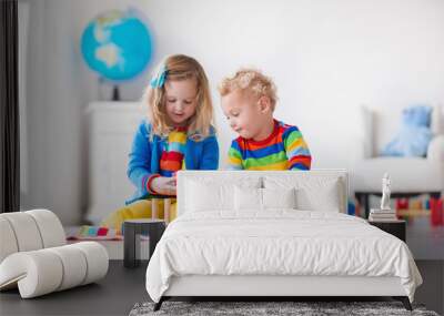 Kids playing with wooden toy train Wall mural