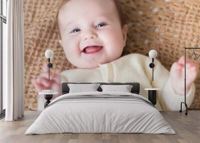 Little baby on a knitted blanket Wall mural