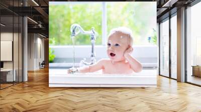 Little baby taking bath Wall mural