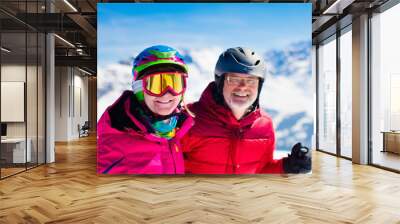 Ski and snow fun in winter mountains Wall mural