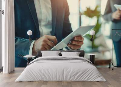 businessman showing tablet at office workplace Wall mural