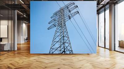 High voltage tower isolated on blue sky. Wall mural