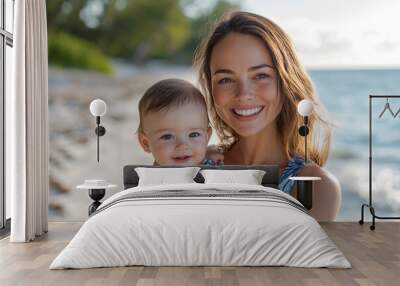 Mother holding child on beach vacation Wall mural