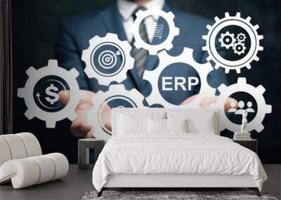 ERP and gear icons. Enterprise resource planning concept. Man holding in his hand Wall mural