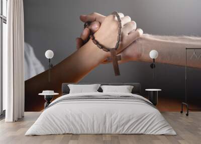 woman and man praying holding a cross Wall mural