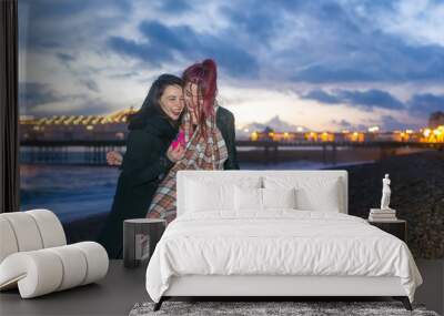 Young lesbian couple enjoying a night out Wall mural