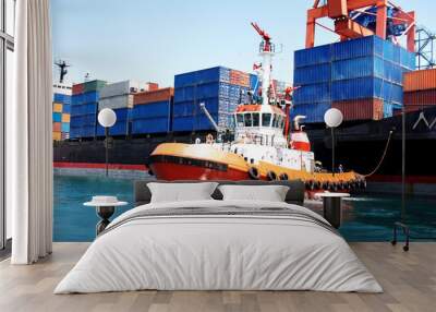 Tug boat pulling out container ship Wall mural