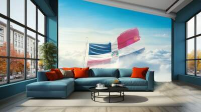 Dominican Republic national flag hidden in the sky. The flag with drone shot in beautiful clouds. Dominican Republic national flag for independence day. Wall mural