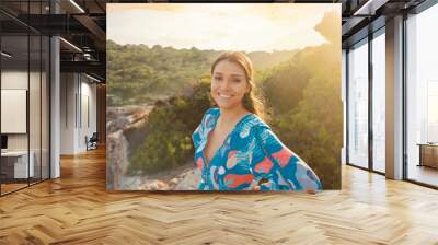 young woman in summer dress at cliff waterfront on Mallorca Wall mural