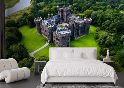 A secluded stone castle nestled within the embrace of a verdant forest. Wall mural