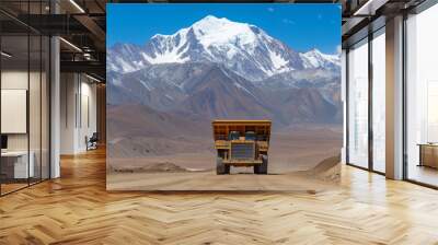 Mining truck working in open pit mine with mountain background Wall mural