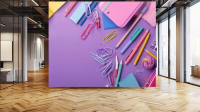 Soft plum background with a creative arrangement of colorful stationery, ideal for back to school campaigns Wall mural