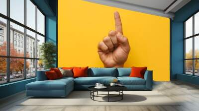 Arm and hand of caucasian man over yellow isolated background snapping fingers for success, easy and click symbol gesture with hand.  Wall mural