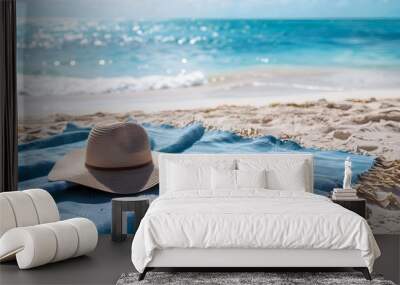 blue towel with hat and summer beach.  Wall mural