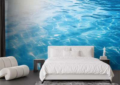 Blue water surface with bright sun light reflections water in swimming pool background closeup  Wall mural