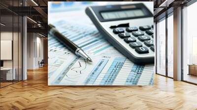 Calculator on financial statement and balance sheeet on desk of auditor. Concept of accounting and audit business.  Wall mural