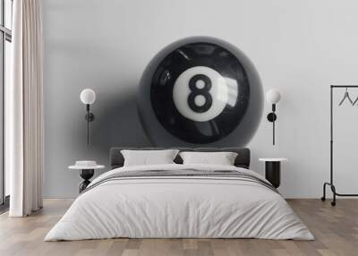 Closeup black eighth billiard ball white background.  Wall mural