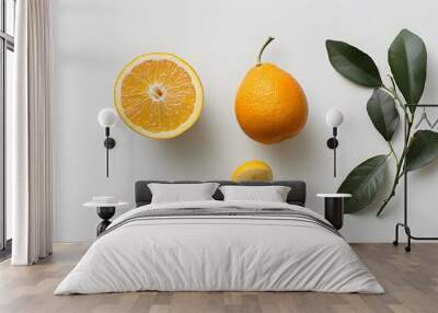 Collection of Fresh half of ripe orange fruit floation with orange juice splash isolated on white background.  Wall mural