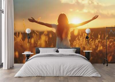 Enjoyment - free happy woman enjoying sunset Wall mural