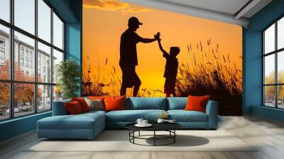 Father giving son high five. Parent child relationship concept.  Wall mural