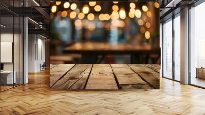 image of wooden table in front of abstract blurred background of resturant lights Wall mural