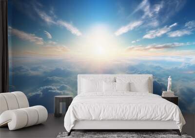 Light from heaven blue planet Earth in white clouds bright sunlight from above Wall mural