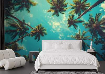 Looking up at blue sky and palm trees, view from below, vintage style, tropical beach and summer background, travel concept.  Wall mural