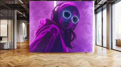 Stylish fashion teenager model wearing hoodie and headphones listening dj music dancing in purple neon lights. Young teen girl enjoy cool music 90s party mix in violet studio background. Copy space.  Wall mural