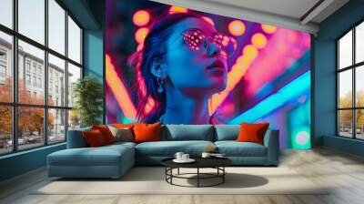 Teen hipster girl standing in neon lights on street, portrait.  Wall mural