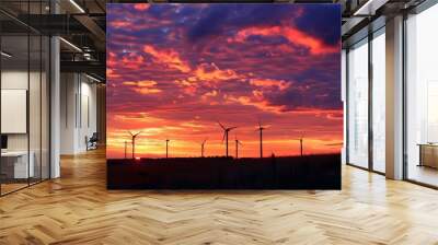 Wind turbine field at sunset, dramatic sky.  Wall mural