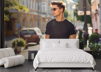 Young Model Shirt Mockup, Boy wearing black t-shirt on street in daylight, Shirt Mockup Template on hipster adult for design print, Male guy wearing casual t-shirt mockup placement. Wall mural