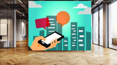 hand holding smartphone with bubble on it and city background Wall mural