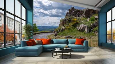 View into the landscape of the southern French Cevennes with a mountain road in the foreground. Wall mural