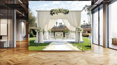 A wedding ceremony is taking place in a garden with a white archway and pink curtains. The scene is elegant and romantic, with a sense of celebration and joy Wall mural